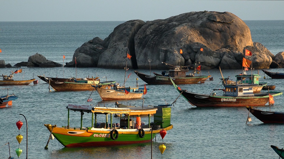 Vietnamese trawlers in a bay.