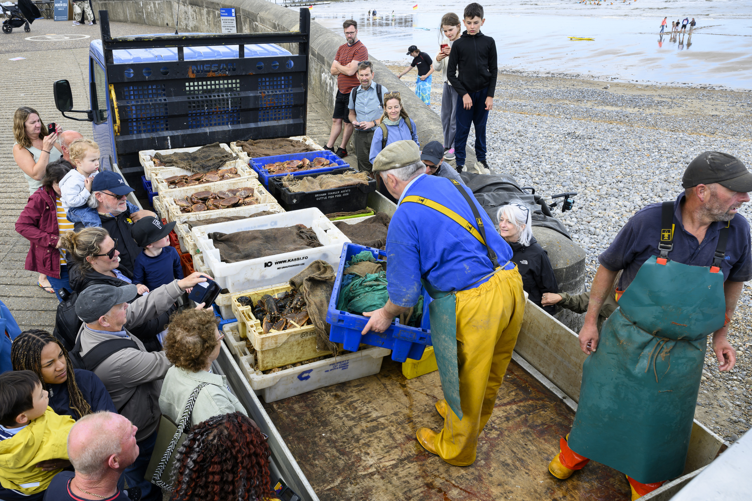 Fishermen unloading fish
